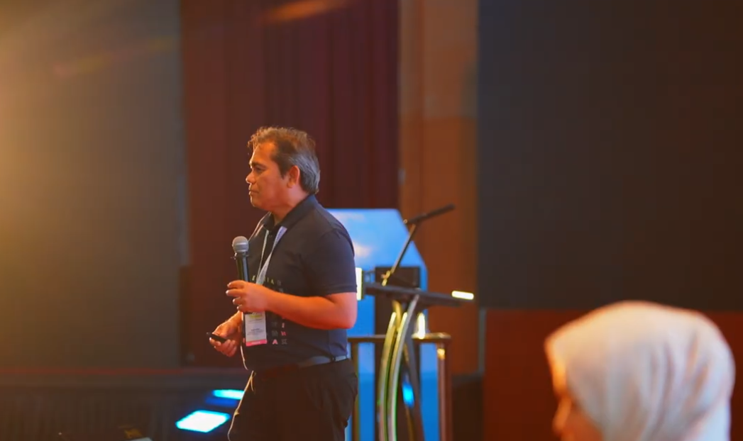 LINDUNG PEKERJA National Forum — main stage and signage